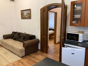Kuchyňa alebo kuchynka v ubytovaní Cédrus apartman + 3 fotografie