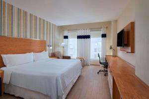 Voodi või voodid majutusasutuse Four Points by Sheraton Cancun Centro toas