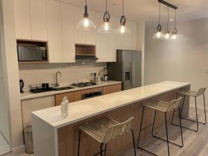 A kitchen or kitchenette at 3BR Concrete Cove in Paracas Beach