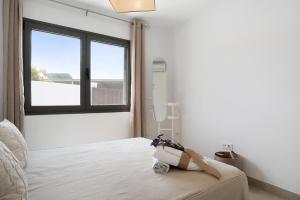 Postel nebo postele na pokoji v ubytování Villa Agapanto + 19 fotografií