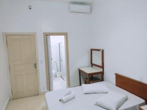 Cama ou camas em um quarto em Grande Hotel Bragança