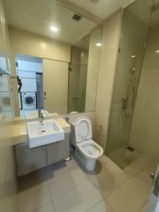 a bathroom with a toilet and a sink and a shower at Duplex M-City ampang klcc by Mint in Kuala Lumpur