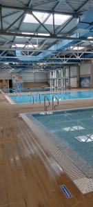 a large swimming pool in a large building at Centar Crnjanski in Jagodina