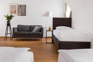 A bed or beds in a room at Hotel Baroko