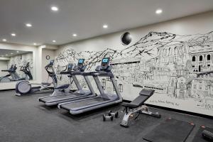 a gym with a large mural on the wall at The Wick, Hudson, a Tribute Portfolio Hotel in Hudson