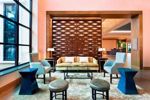 a lobby with a couch and chairs and windows at The Westin Jekyll Island in Jekyll Island