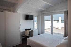 Postel nebo postele na pokoji v ubytování Nauticus Hotel Ugento