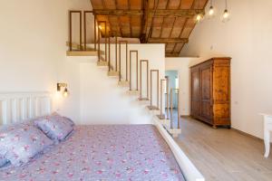 Postel nebo postele na pokoji v ubytování B&B Podere Curtatone
