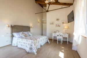 Postel nebo postele na pokoji v ubytování B&B Podere Curtatone