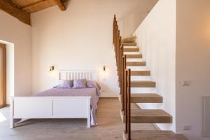 Postel nebo postele na pokoji v ubytování B&B Podere Curtatone