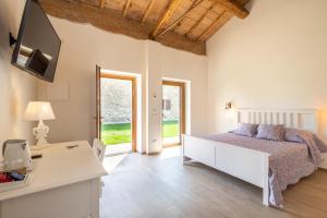 Postel nebo postele na pokoji v ubytování B&B Podere Curtatone