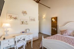 Postel nebo postele na pokoji v ubytování B&B Podere Curtatone