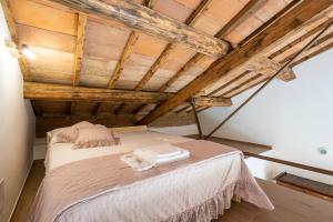 Postel nebo postele na pokoji v ubytování B&B Podere Curtatone