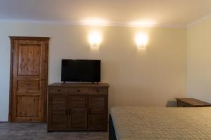 TV a/nebo společenská místnost v ubytování Taverna & Rooms