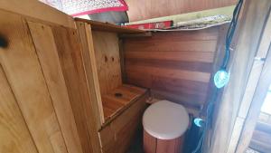 a small bathroom with a toilet in a wooden cabin at Le Salon des Inconnus in Namur +62 photos