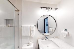 a white bathroom with a sink and a mirror at Beaver Creeks Meadows in Beaver Creek +51 photos