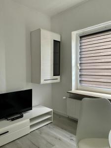 TV a/nebo společenská místnost v ubytování 2- Zimmer Wohnung