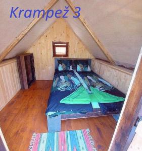a room with a bed in a attic at Krampez in Kobarid