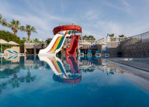 a water slide in the swimming pool at a resort at Gumbet Anil Beach in Gümbet +27 photos