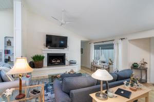a living room with two couches and a fireplace at 2932 Captain Sams in Johns Island