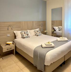 Un pat sau paturi într-o cameră la La Villetta del Golfo