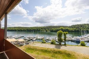 a view of a marina with boats in the water at Ferienwohnungen direkt am Werbellinsee in Joachimsthal