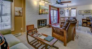 a living room with a couch and a fireplace at Bear Claw 104 - Bear Claw I Building in Steamboat Springs