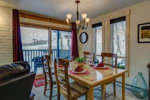 a dining room with a wooden table and chairs at Bear Claw 104 - Bear Claw I Building in Steamboat Springs