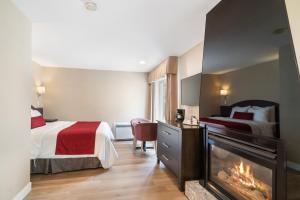 Postel nebo postele na pokoji v ubytování Hotel Bromont