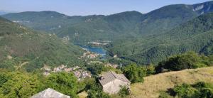 an aerial view of a valley in the mountains at Old Town House in San Romano