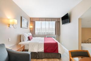 Postel nebo postele na pokoji v ubytování Hotel Bromont