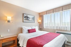 Postel nebo postele na pokoji v ubytování Hotel Bromont
