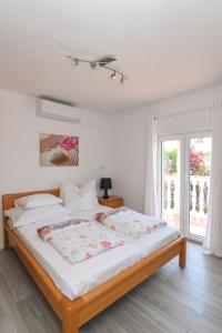 Postel nebo postele na pokoji v ubytování Apartments Basic Sveti Anton 88