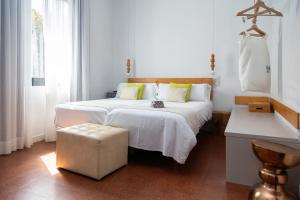 Posteľ alebo postele v izbe v ubytovaní Hotel Catalina