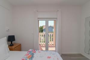 Postel nebo postele na pokoji v ubytování Apartments Basic Sveti Anton 88