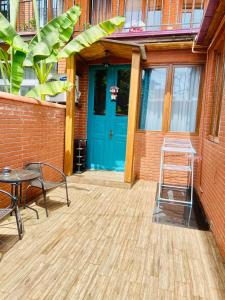 a front door of a building with a blue door at 9 Borbalo Street Apartment with terrace in Tbilisi City