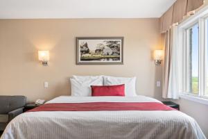 Postel nebo postele na pokoji v ubytování Hotel Bromont
