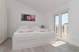 Postel nebo postele na pokoji v ubytování Apartments Basic Sveti Anton 88