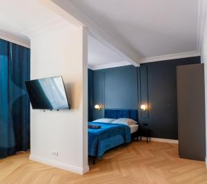 Ένα ή περισσότερα κρεβάτια σε δωμάτιο στο Apartament Zwycięzców 2
