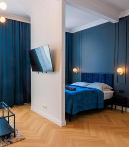 Ένα ή περισσότερα κρεβάτια σε δωμάτιο στο Apartament Zwycięzców 2