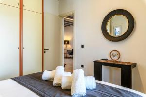 Postel nebo postele na pokoji v ubytování Aurora Mykonos Villas