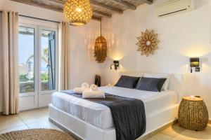 Postel nebo postele na pokoji v ubytování Aurora Mykonos Villas + 37 fotografií