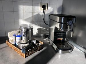 a coffee maker sitting on a kitchen counter with a tray at SANABRIA - Palacio de La Cuesta in Palacios de Sanabria