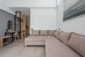 a living room with a couch and a table at Val Del Mar in Skala Fourkas
