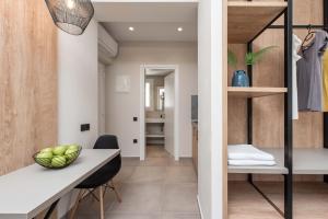 a kitchen and dining room with a table and chairs at Val Del Mar in Skala Fourkas