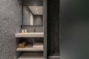a bathroom with a sink and a mirror at Val Del Mar in Skala Fourkas