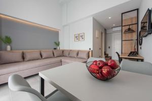 a living room with a bowl of apples on a table at Val Del Mar in Skala Fourkas