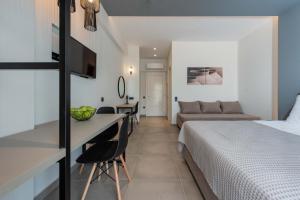 a hotel room with a bed and a desk at Val Del Mar in Skala Fourkas