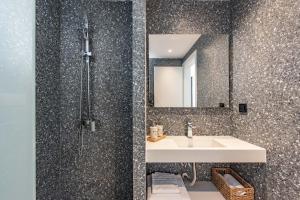 a bathroom with a sink and a mirror at Val Del Mar in Skala Fourkas