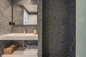 a bathroom with a sink and a mirror at Val Del Mar in Skala Fourkas